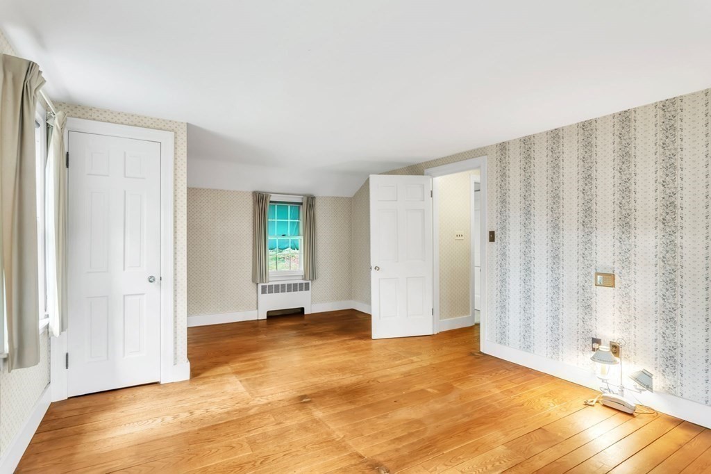 30 Green River Road Greenfield, MA 01301 - Photo 23 of 34 a view of an empty room with window and hardwood floor