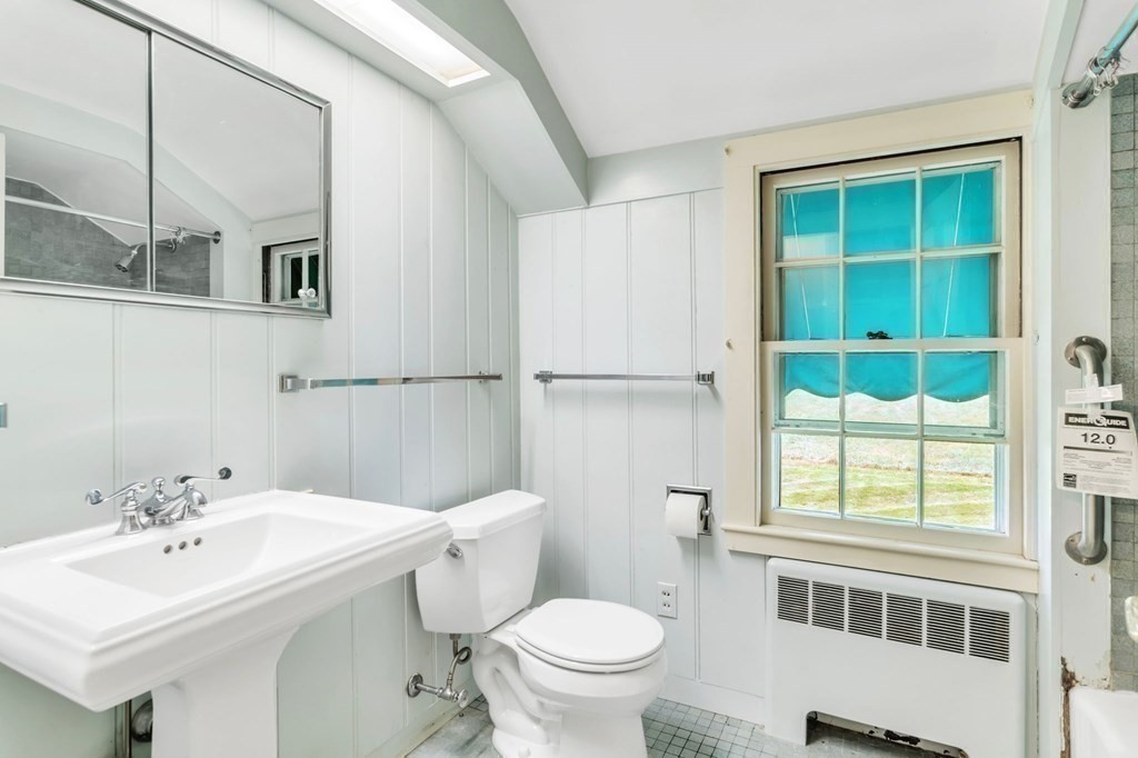 30 Green River Road Greenfield, MA 01301 - Photo 25 of 34 a bathroom with a sink a toilet and a mirror