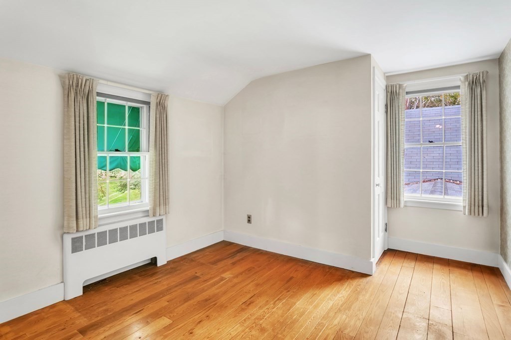 30 Green River Road Greenfield, MA 01301 - Photo 26 of 34 an empty room with wooden floor and windows