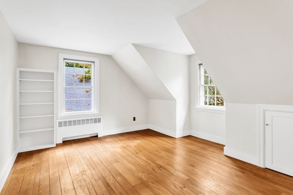 30 Green River Road Greenfield, MA 01301 - Photo 29 of 34 an empty room with wooden floor closet and windows