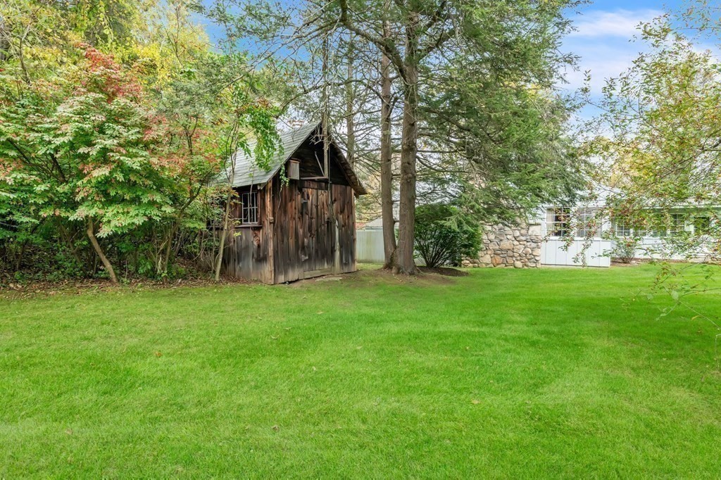 30 Green River Road Greenfield, MA 01301 - Photo 30 of 34 a view of a wooden house with a big yard and large trees