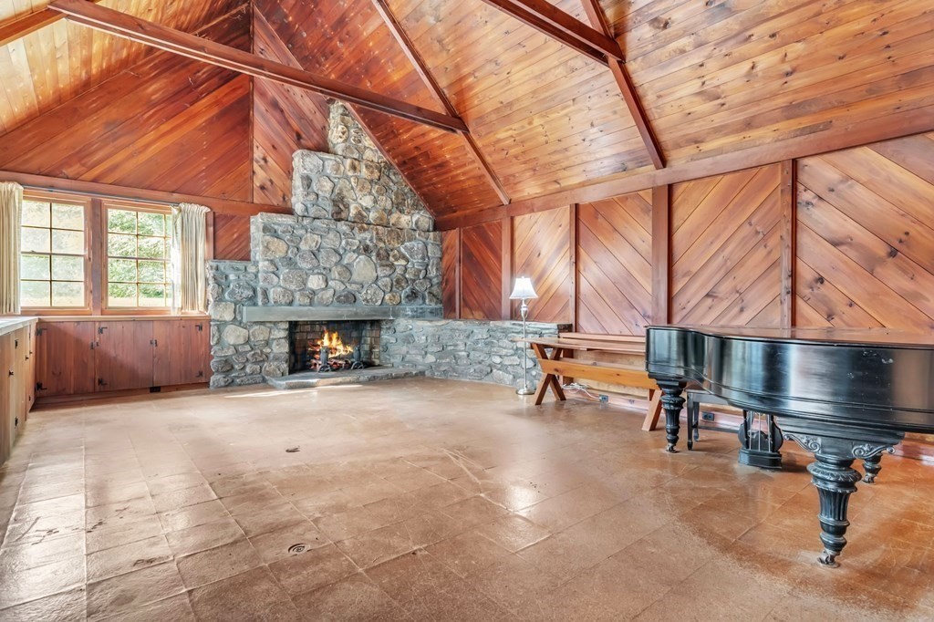 30 Green River Road Greenfield, MA 01301 - Photo 7 of 34 a backyard of a house with fireplace and outdoor seating