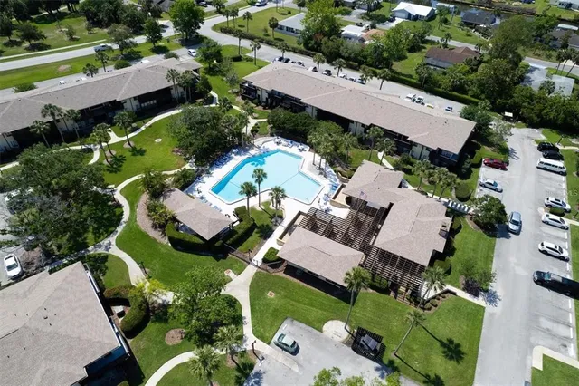 an aerial view of a house with a garden