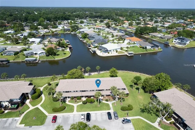 an aerial view of houses with yard