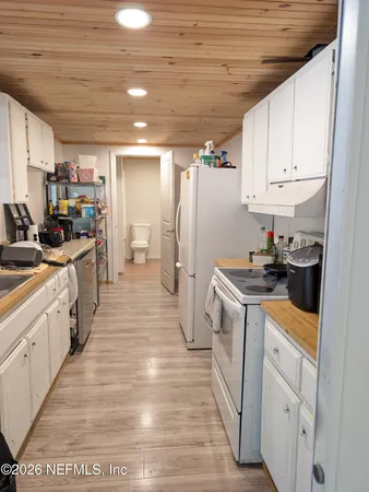 a bathroom with a toilet a sink and bathtub