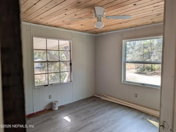a room with gym equipment and a large window