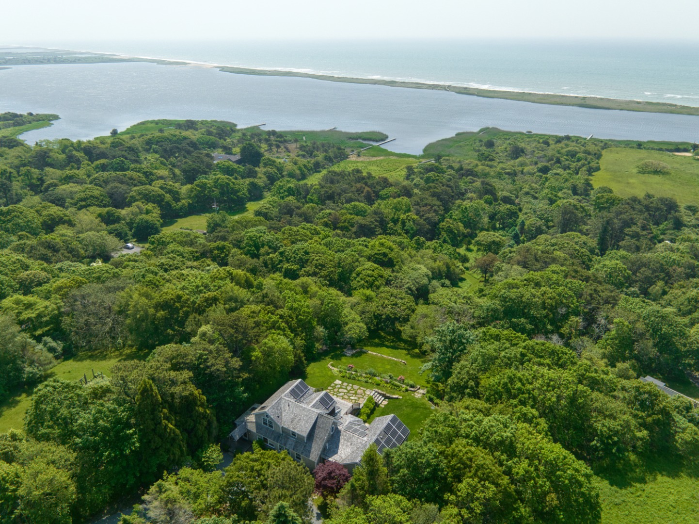 an aerial view of a house with a garden