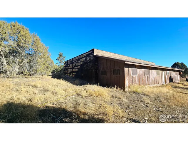a view of wooden floor and a flat screen tv