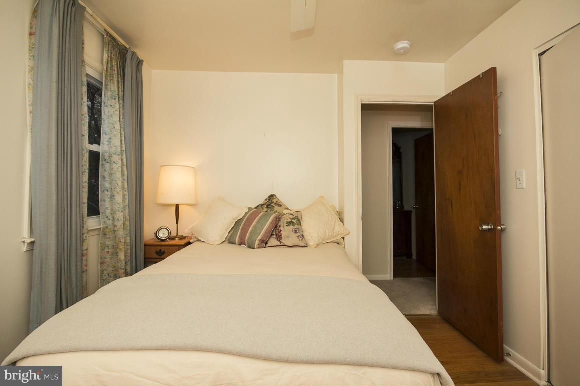221 Bynum Ridge Road Forest Hill, MD 21050 - Photo 14 of 20 a large bedroom with a bed and a mirror