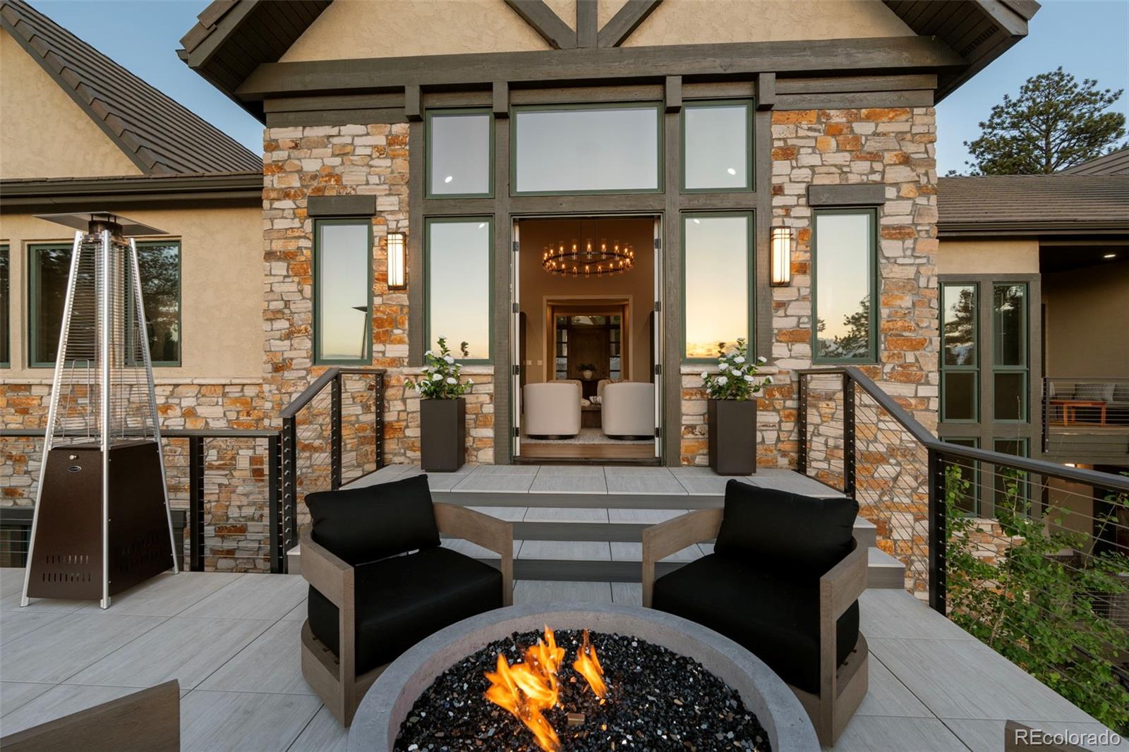 730 Genesee Mountain Road Golden, CO 80401 - Photo 41 of 50 a view of a patio with couches table and chairs and potted plants