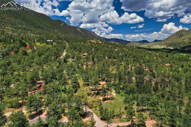 4980 Dodd Road Cascade, CO 80809 - Photo 6 of 48 Aerial view of home and property with mountainous surroundings