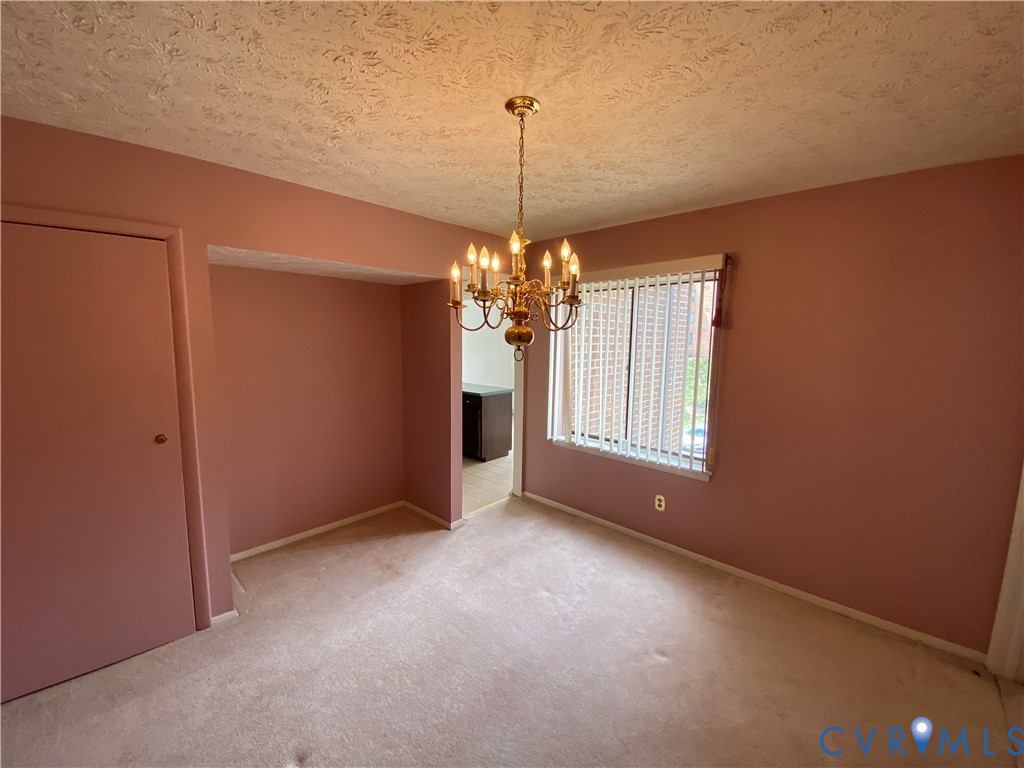 1507 Bronwyn Road, Unit 301 Henrico, VA 23238 - Photo 17 of 41 a view of a room with window and chandelier