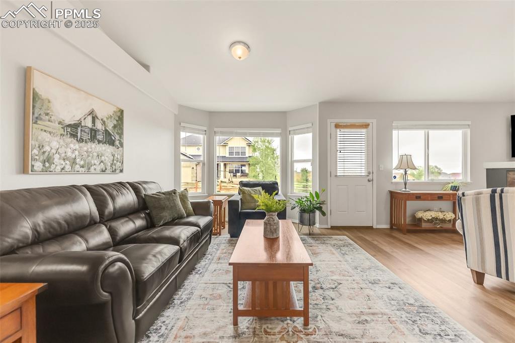 10467 Pictured Rocks Drive Peyton, CO 80831 - Photo 11 of 47 a living room with furniture a large window and a table