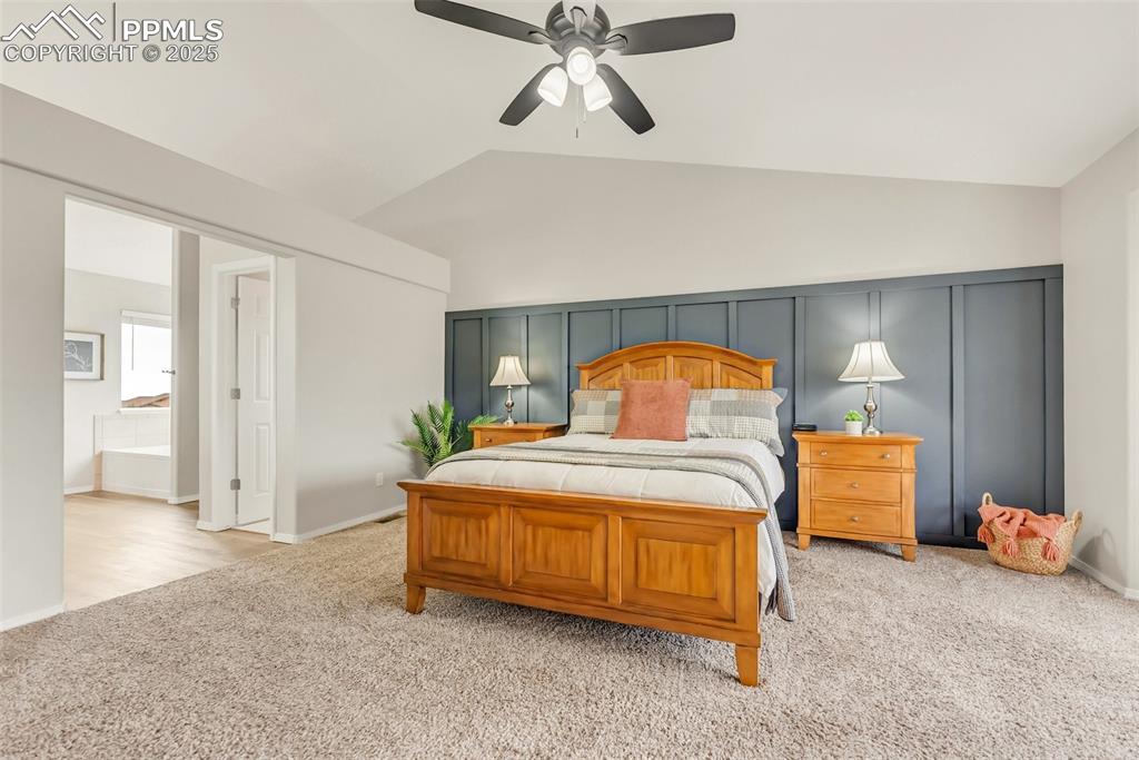 10467 Pictured Rocks Drive Peyton, CO 80831 - Photo 19 of 47 a bedroom with a bed and a chandelier
