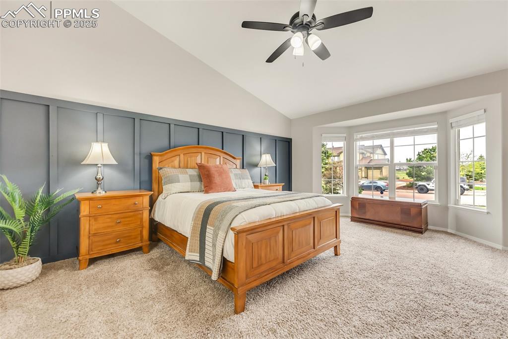 10467 Pictured Rocks Drive Peyton, CO 80831 - Photo 22 of 47 a bedroom with a bed and a chandelier