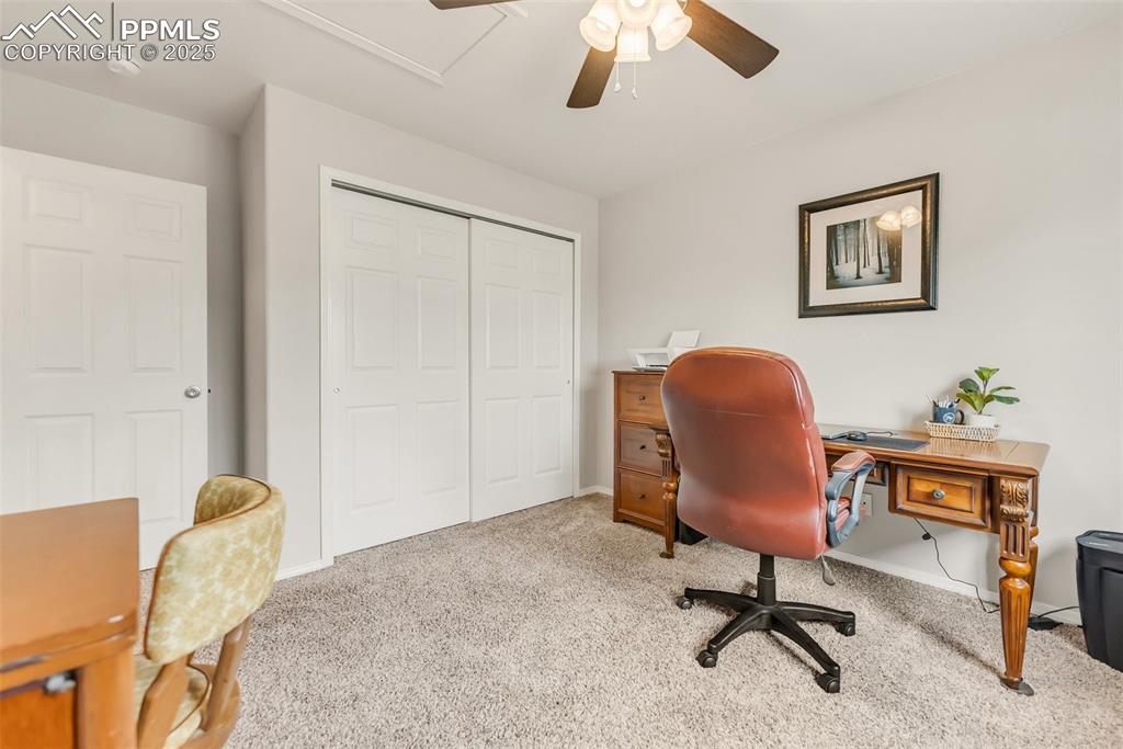 10467 Pictured Rocks Drive Peyton, CO 80831 - Photo 29 of 47 a view of a workspace with furniture and a window