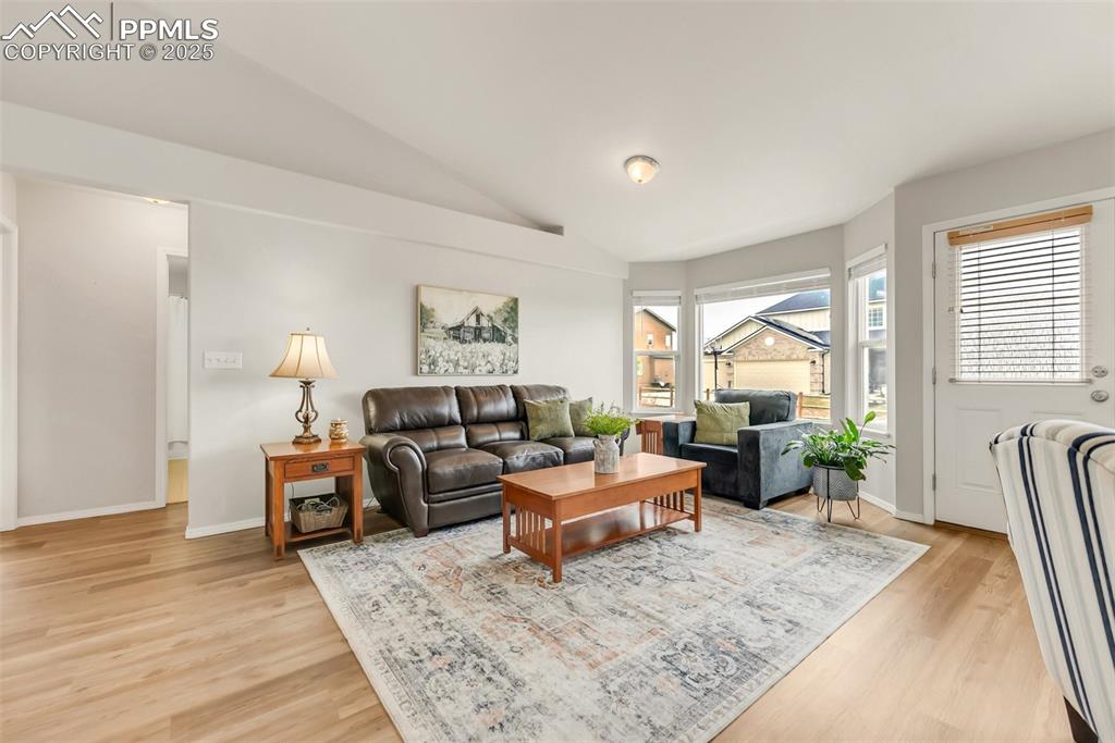 10467 Pictured Rocks Drive Peyton, CO 80831 - Photo 9 of 47 a living room with furniture and a large window