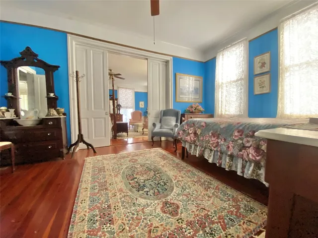 a bedroom with double bed and a dresser