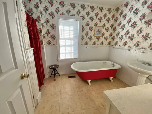 a living room with furniture and a rug
