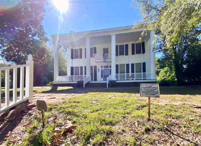a view of a house with swimming pool
