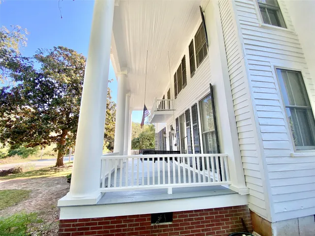 a view of a brick house with a large window