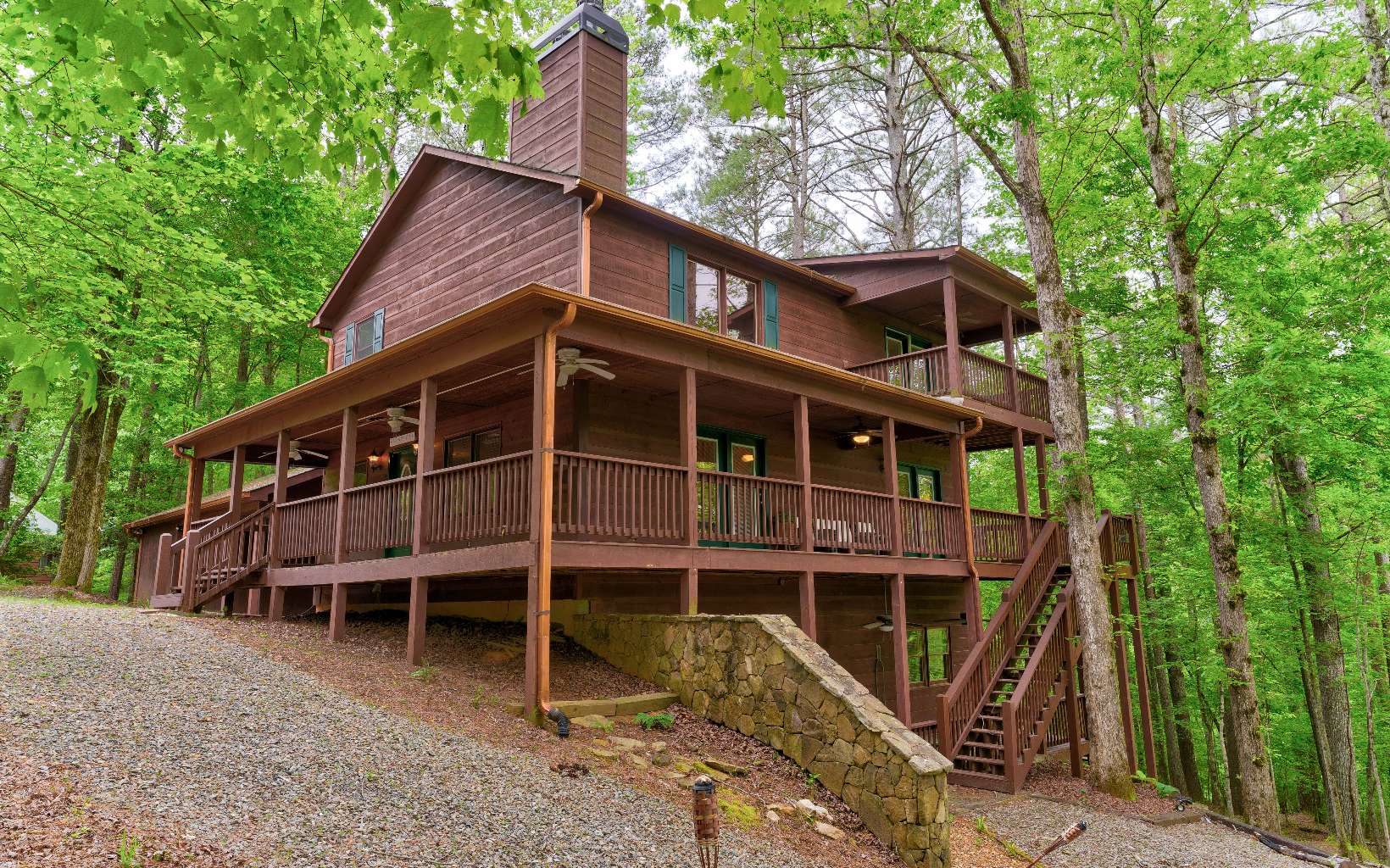 22 Kings Court Ellijay, GA 30540 - Photo 1 of 54 a front view of a house with a porch
