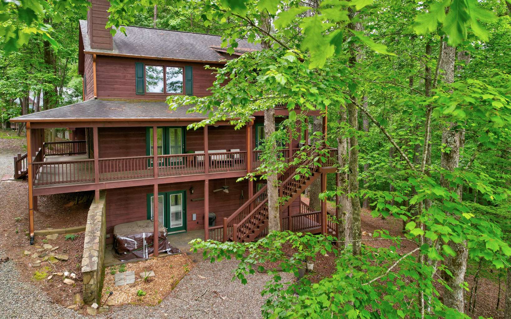 22 Kings Court Ellijay, GA 30540 - Photo 11 of 54 a front view of a house with a yard