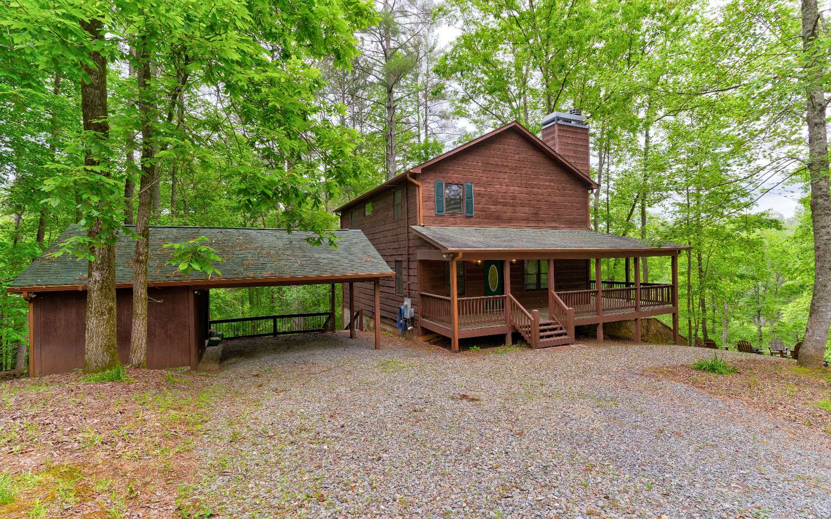 22 Kings Court Ellijay, GA 30540 - Photo 14 of 54 a view of a house with a yard and large trees