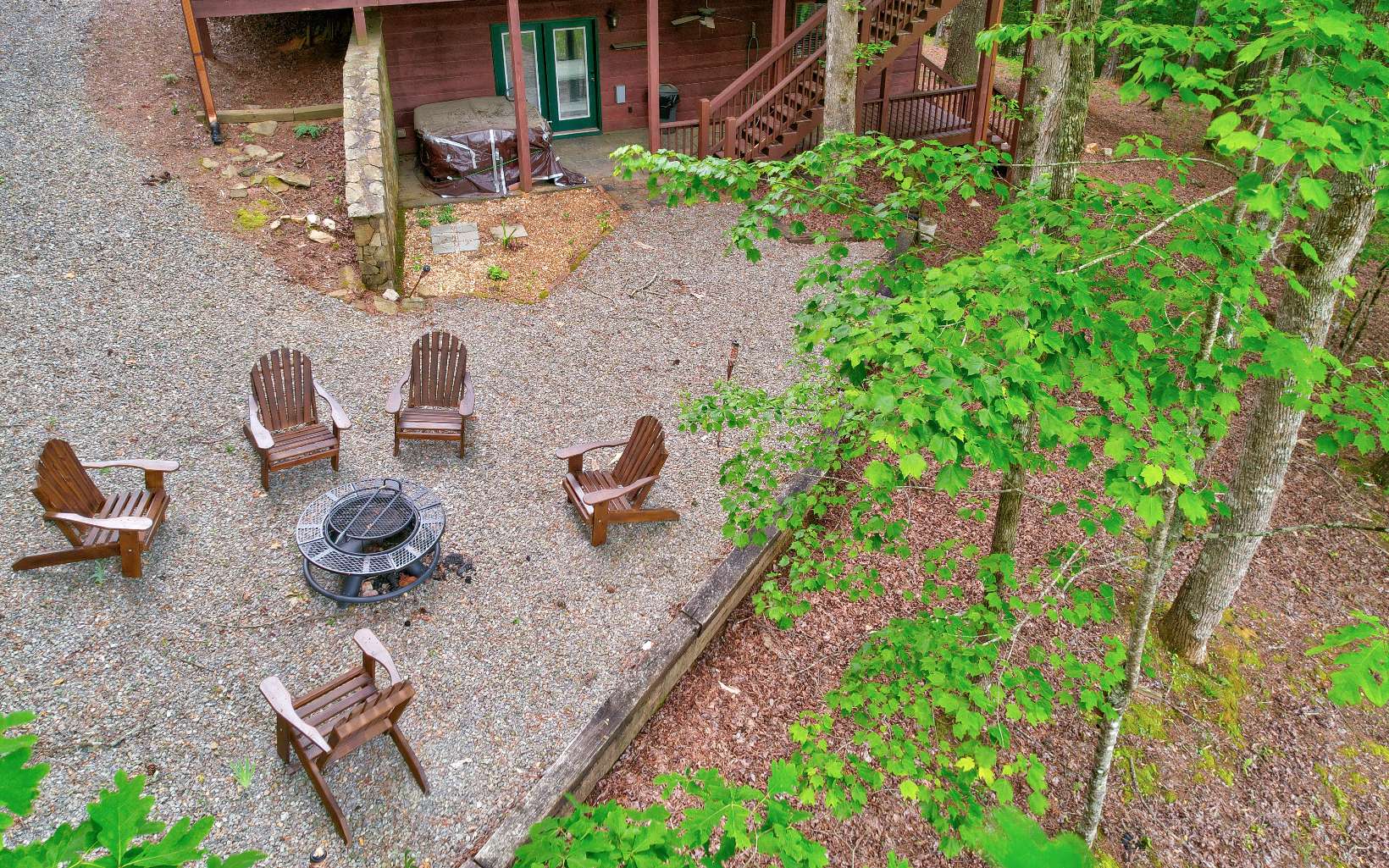 22 Kings Court Ellijay, GA 30540 - Photo 19 of 54 a backyard of a house with seating space