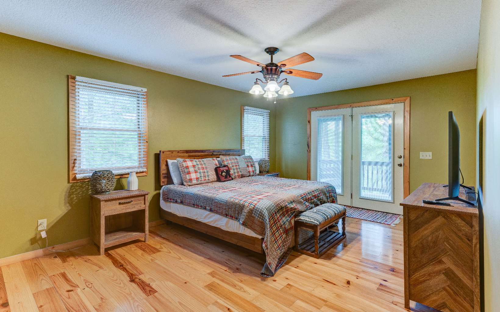 22 Kings Court Ellijay, GA 30540 - Photo 31 of 54 a bedroom with a bed and wooden floor