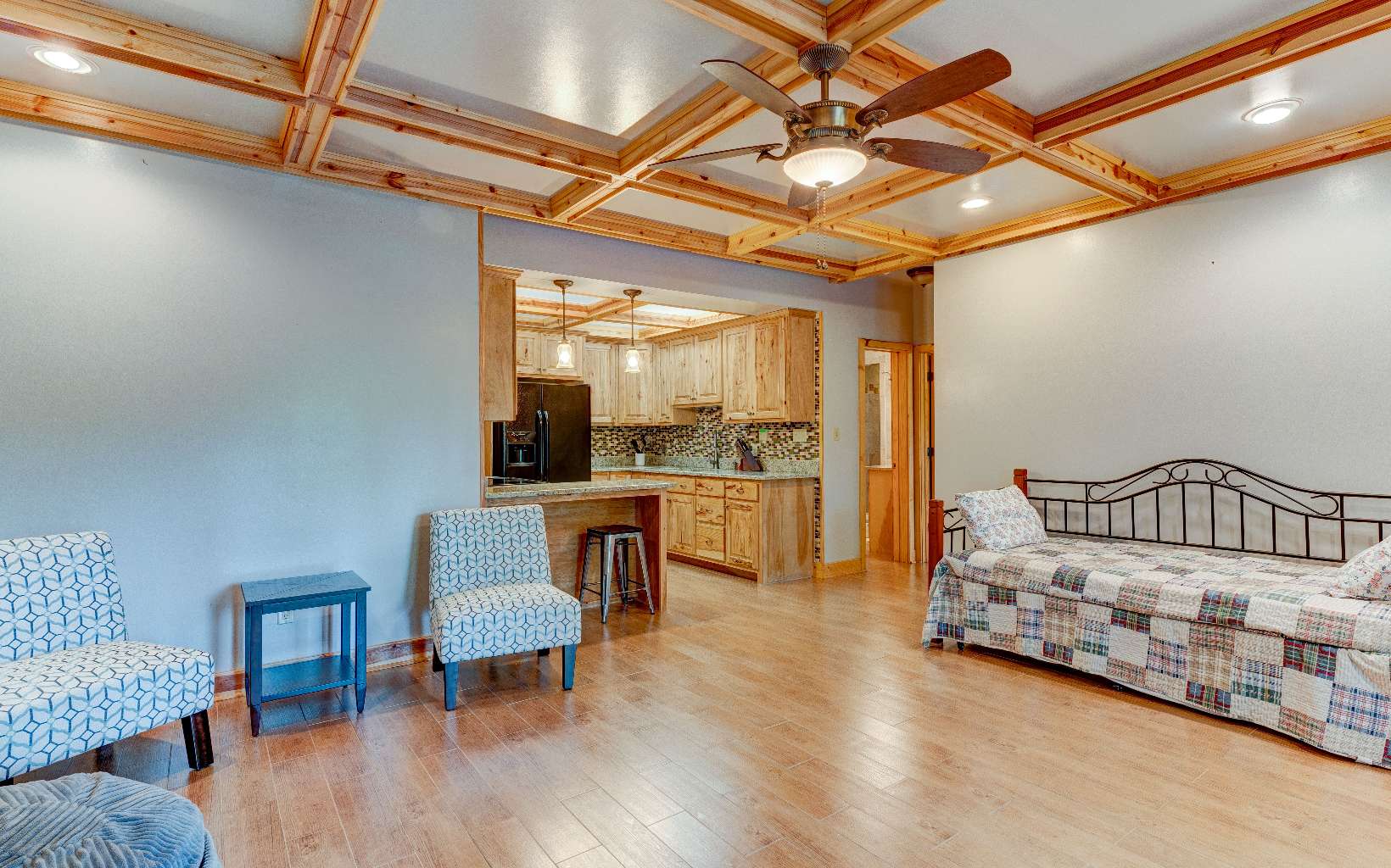 22 Kings Court Ellijay, GA 30540 - Photo 39 of 54 a bedroom with furniture and a wooden floor