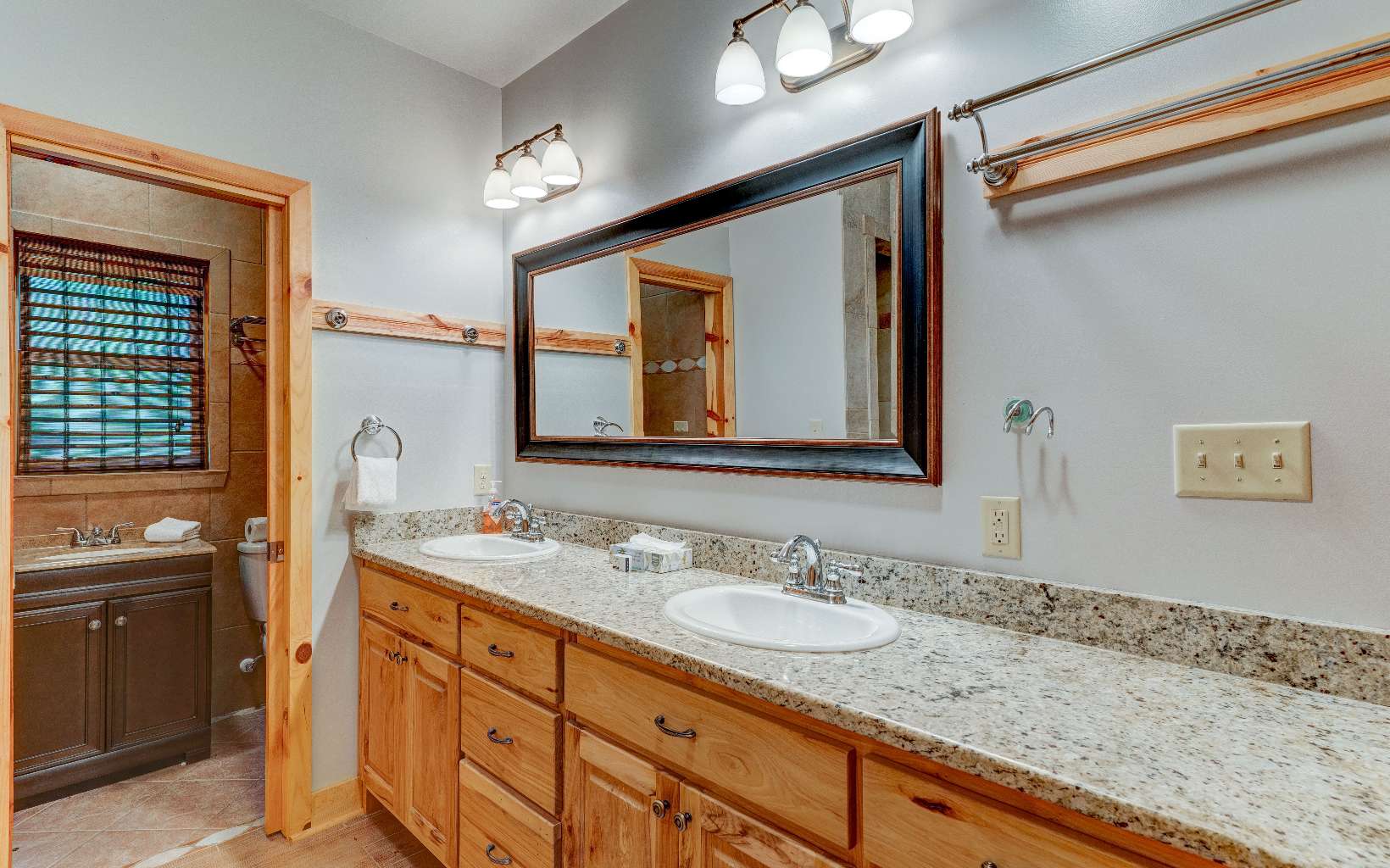22 Kings Court Ellijay, GA 30540 - Photo 42 of 54 a bathroom with a granite countertop sink double vanity and a mirror