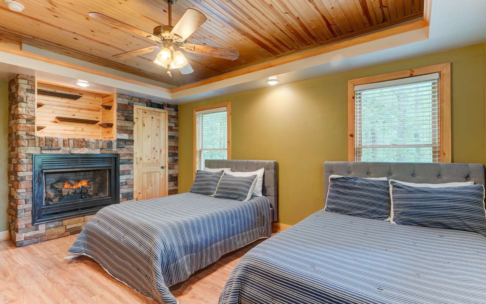 22 Kings Court Ellijay, GA 30540 - Photo 47 of 54 a bedroom with two beds and a fireplace
