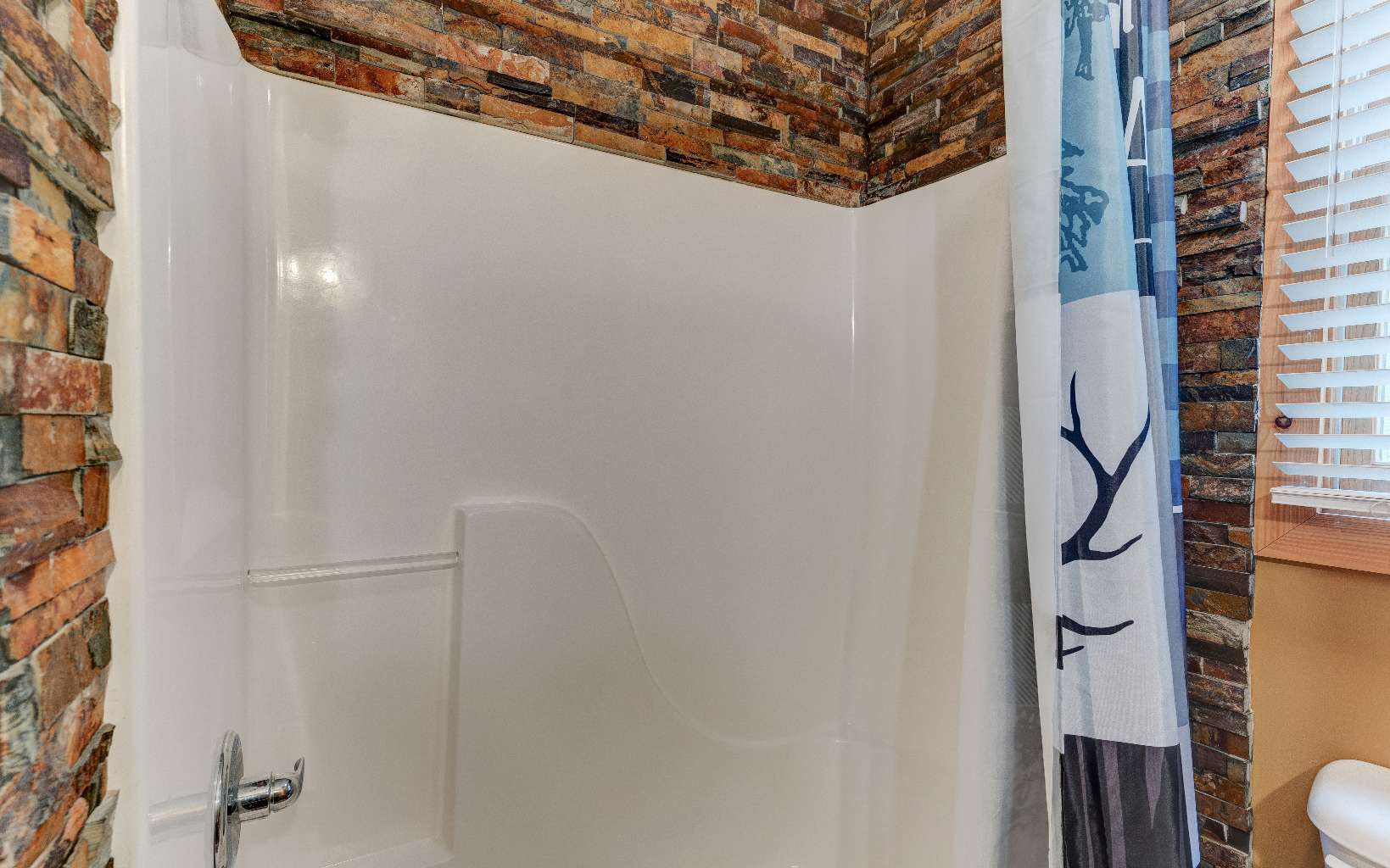 22 Kings Court Ellijay, GA 30540 - Photo 50 of 54 a bathroom with a shower