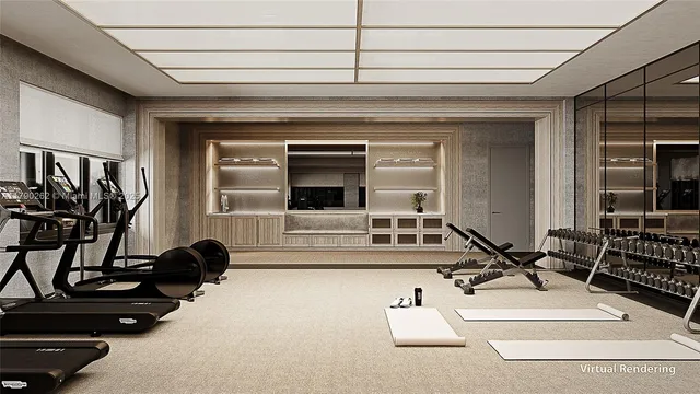 a living room with furniture gym equipment and a large window
