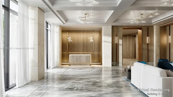 a view of a hallway with furniture and a chandelier