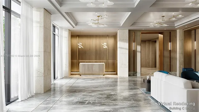 a view of a hallway with furniture and a chandelier