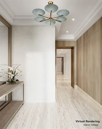 a view of a hallway to a room with a ceiling fan and a kitchen