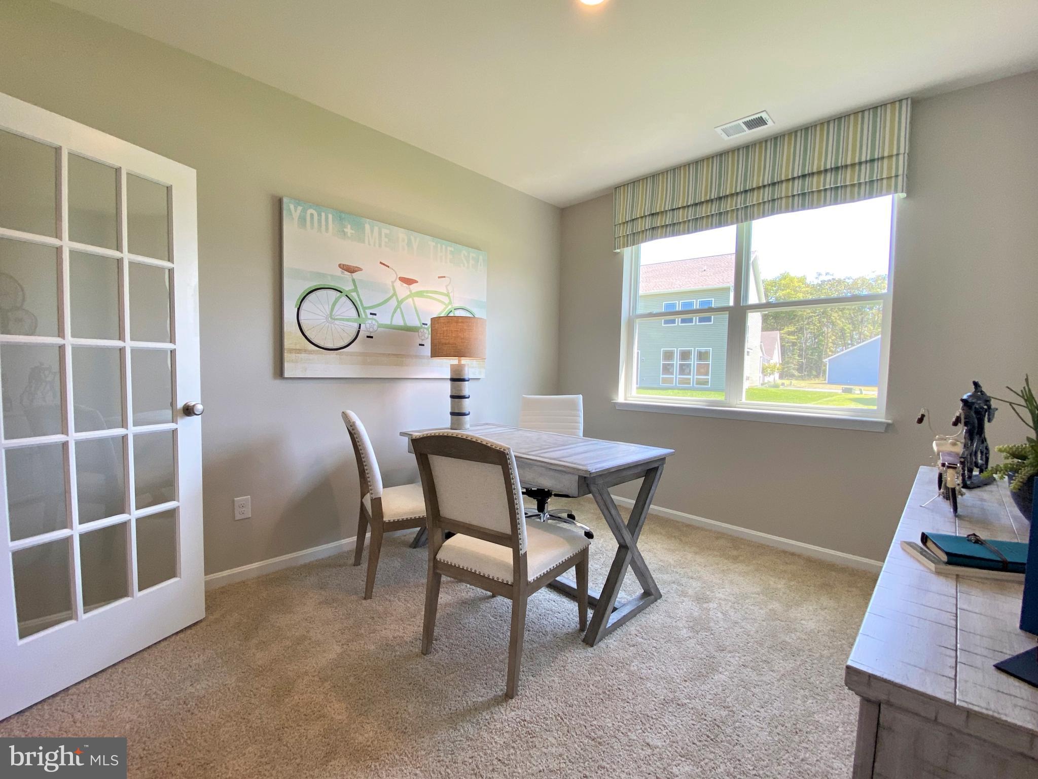 8740 Harper Way Easton, MD 21601 - Photo 8 of 26 a view of a livingroom with furniture and window