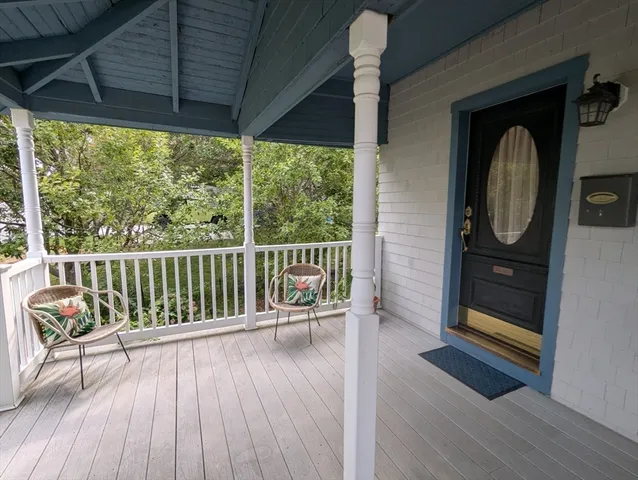 a view of a two chairs in the balcony