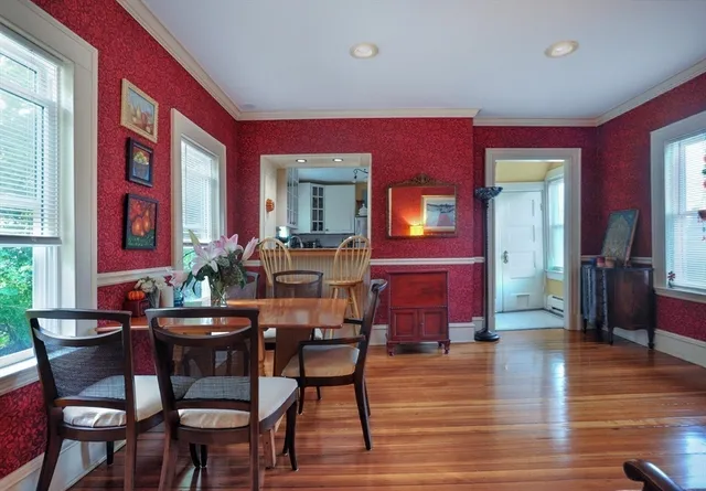 a view of a dining room with furniture window and wooden floor