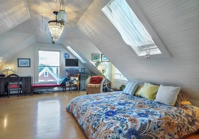 a bedroom with bed and window