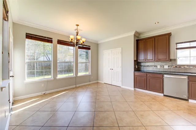 a view of a kitchen with a sink and cabinets