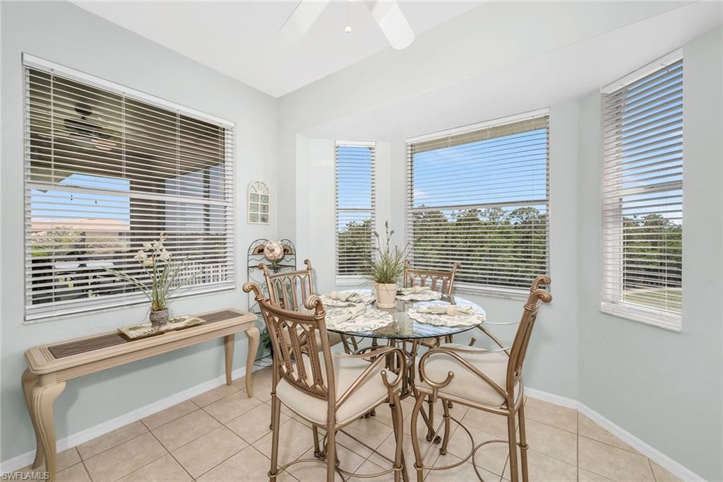 3800 Sawgrass Way, Unit 3142 Naples, FL 34112 - Photo 15 of 50 a dining room with furniture and windows