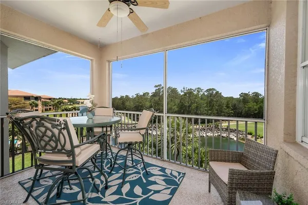 a view of a chairs and table in patio