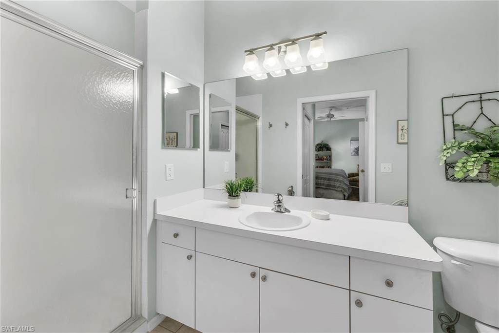 3800 Sawgrass Way, Unit 3142 Naples, FL 34112 - Photo 22 of 50 a bathroom with a sink and a mirror