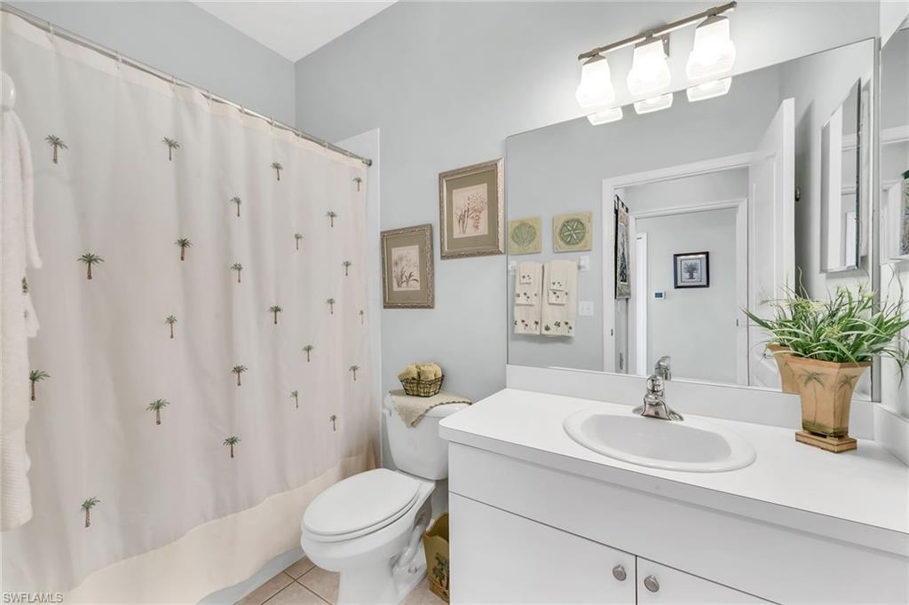 3800 Sawgrass Way, Unit 3142 Naples, FL 34112 - Photo 25 of 50 a bathroom with a sink toilet and shower