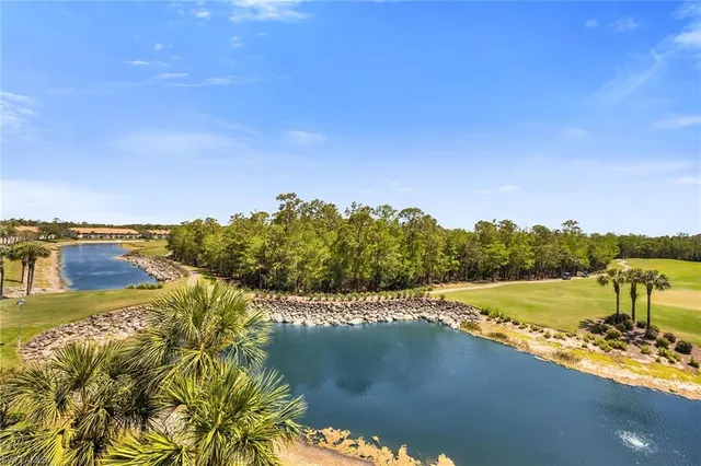 a view of an ocean with a mountain
