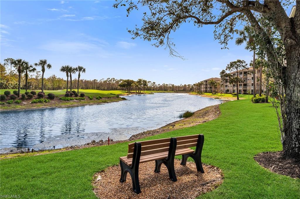 3800 Sawgrass Way, Unit 3142 Naples, FL 34112 - Photo 31 of 50 a view of a lake with houses in the back