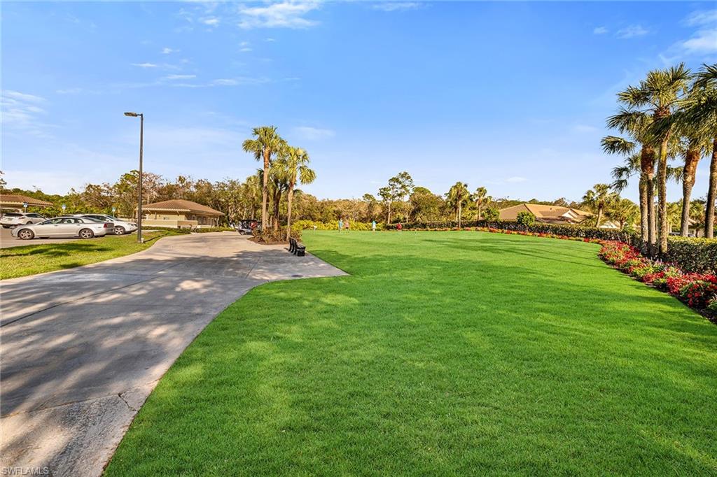 3800 Sawgrass Way, Unit 3142 Naples, FL 34112 - Photo 34 of 50 a view of a garden